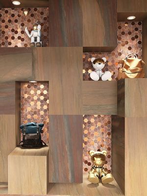 Las pantallas de pared de mosaicos hexagonales de metal únicos crean espacios de lujo vintage para hoteles